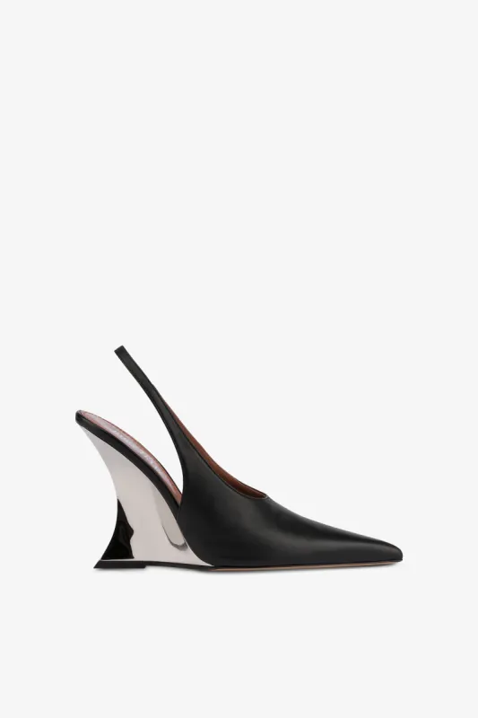 Slingbacks in black and silver leather sold by Paris Texas