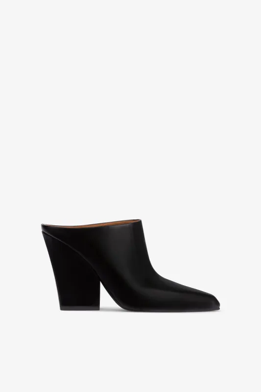 Long, pointed mule boots in soft black brushed leather sold by Paris Texas