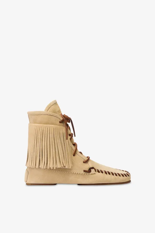 Boots in ecru suede leather sold by Paris Texas