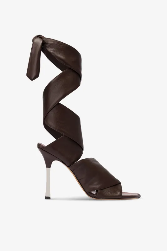 Wrap-around sandals in ebony leather sold by Paris Texas