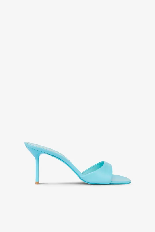Mules in turquoise leather sold by Paris Texas