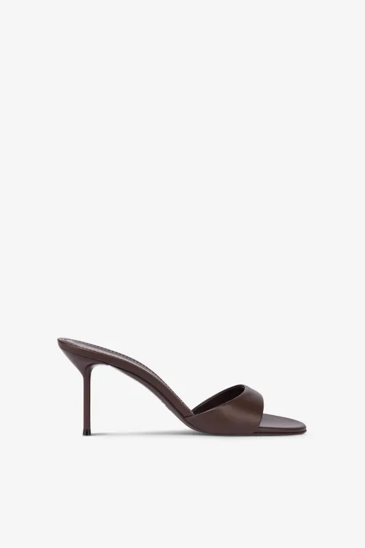 Mules in ebony leather sold by Paris Texas