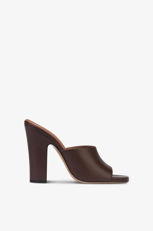 Mules in ebony leather sold by Paris Texas