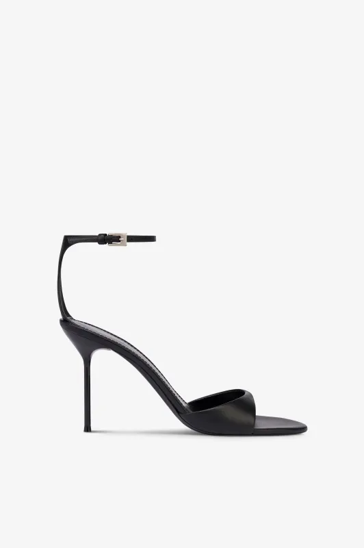 Sandals in black leather sold by Paris Texas