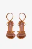 Sandals in orange sunset mirror-effect leather sold by Paris Texas