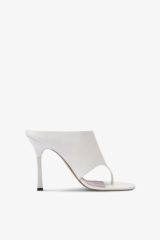 Mules in white leather sold by Paris Texas