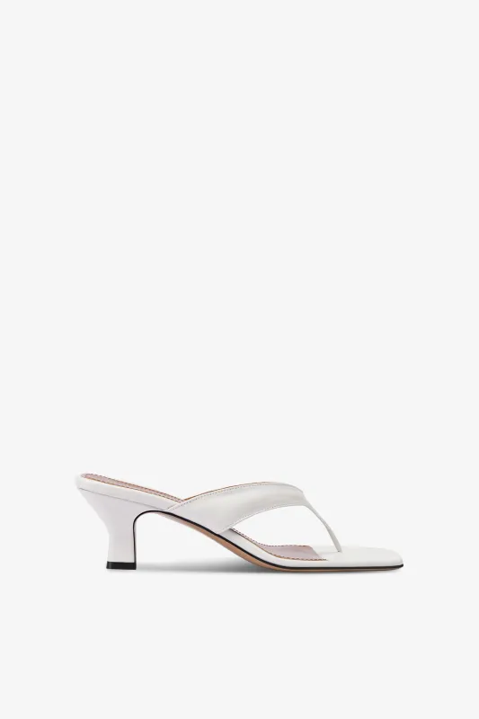 Mules with a toe in white leather sold by Paris Texas