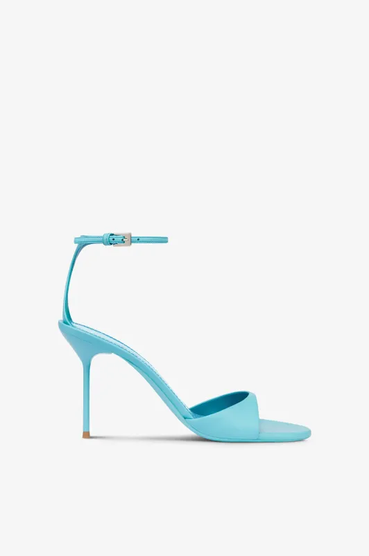 Sandals in turquoise leather sold by Paris Texas