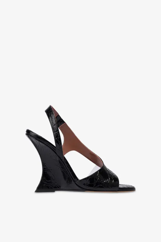 Slingbacks in black PVC and croco-embossed leather sold by Paris Texas