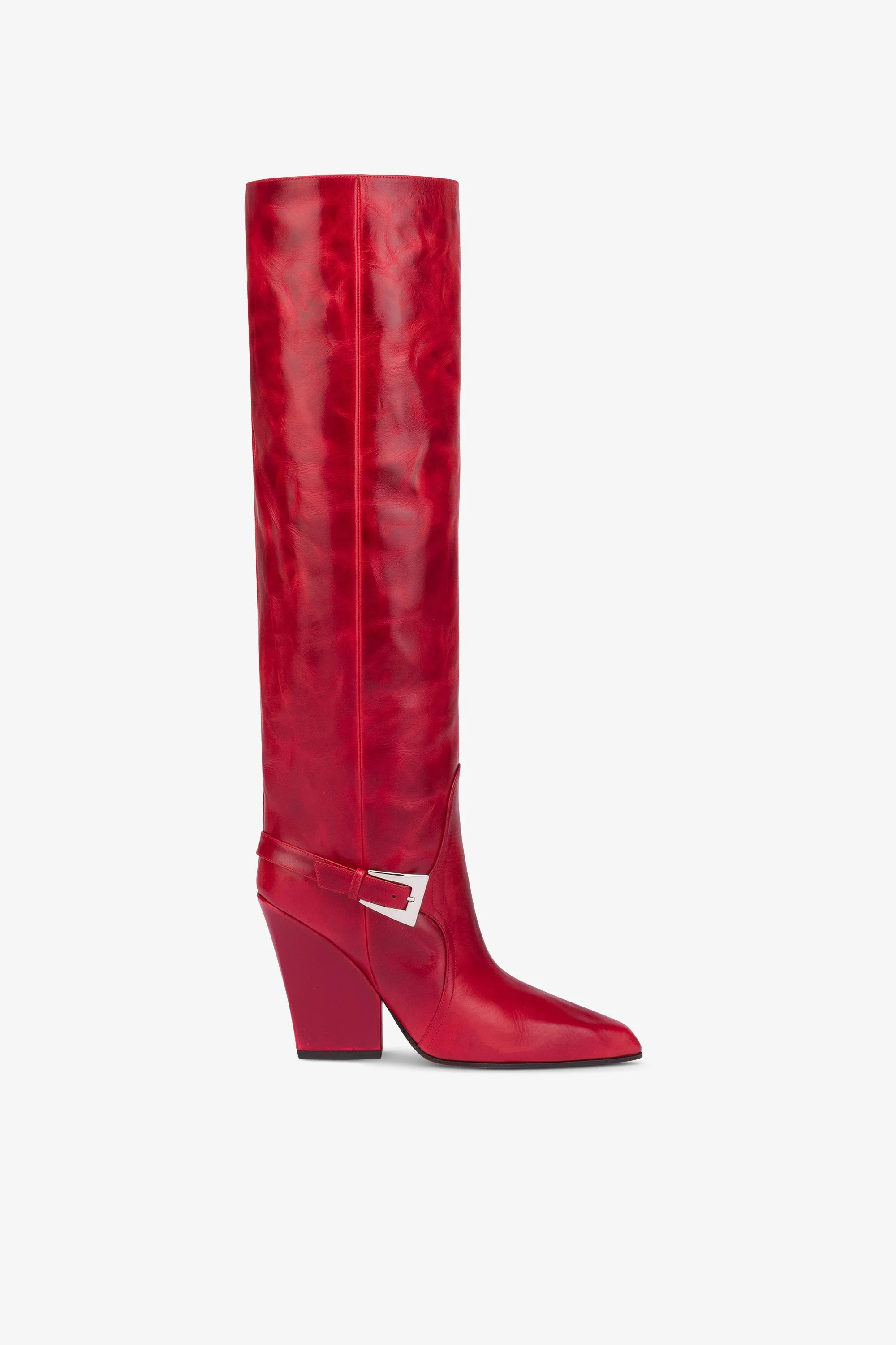 Tall, knee-high boots in shiny fiesta vintage leather sold by Paris Texas