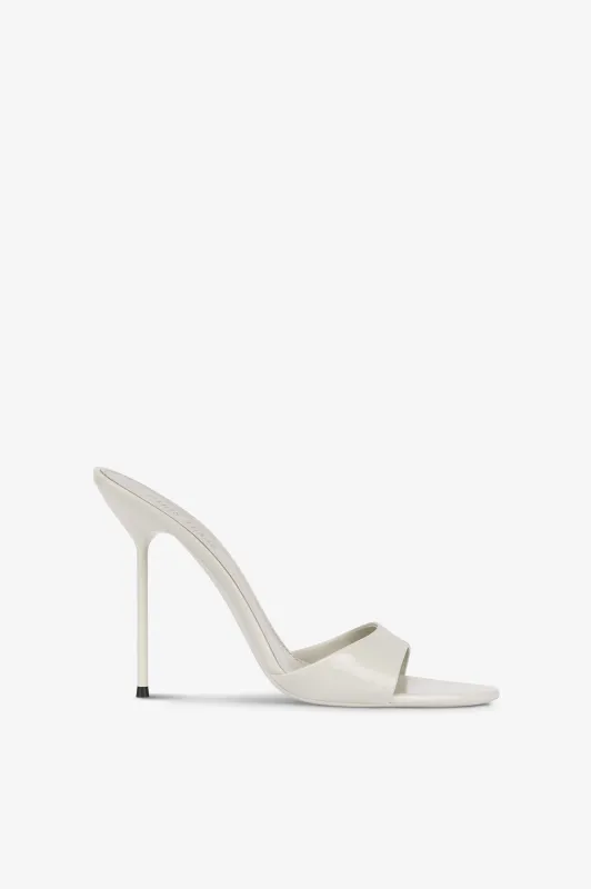 Mules in ice grey patent leather sold by Paris Texas