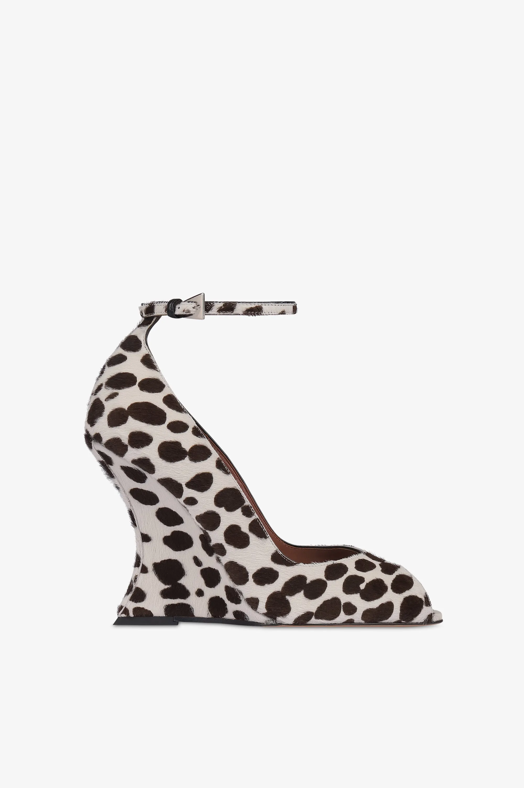Pumps in white and dark brown printed cowhide sold by Paris Texas