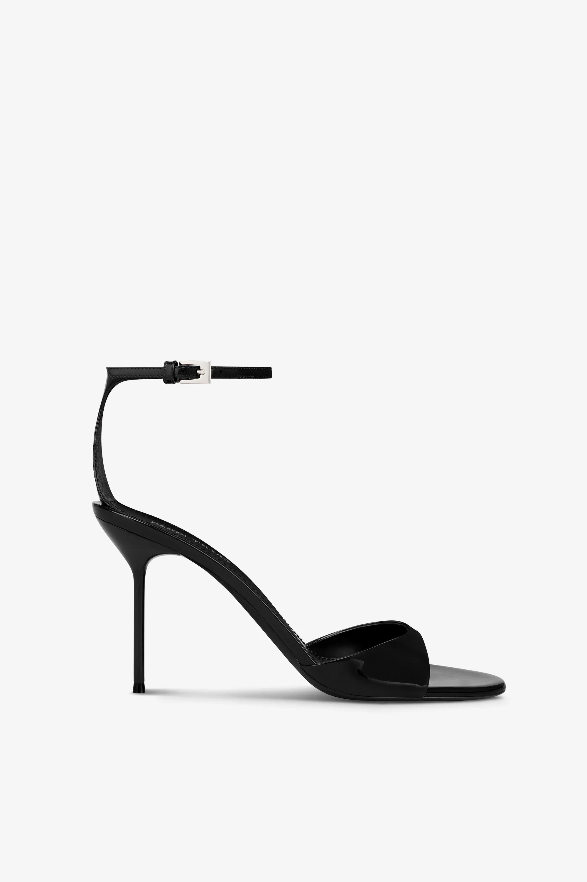 Sandals in black patent leather sold by Paris Texas