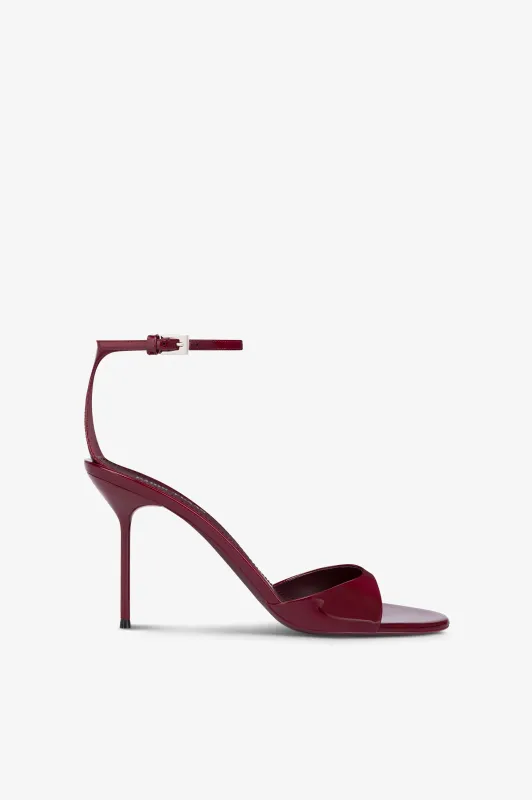 Sandals in rouge noir patent leather sold by Paris Texas