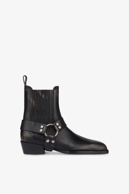 Ankle boots in black brushed leather sold by Paris Texas