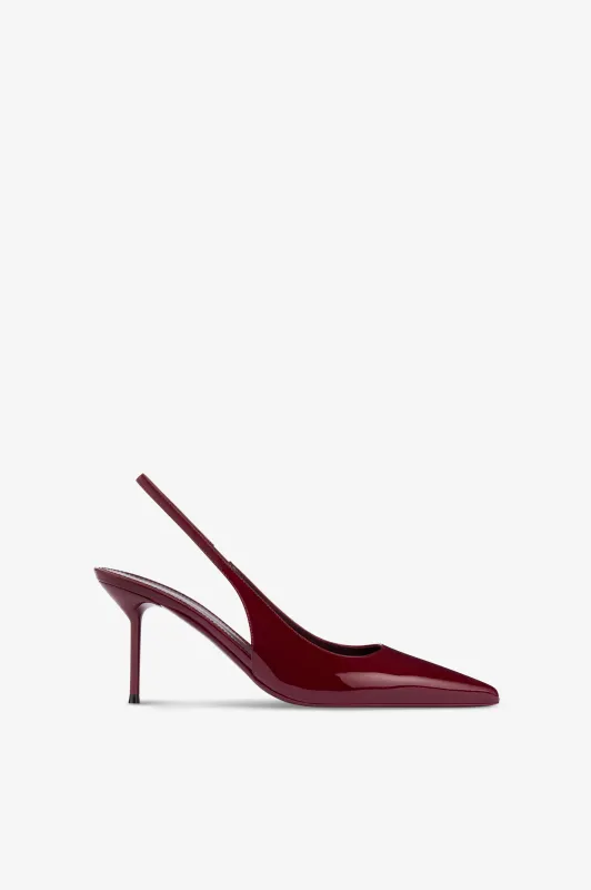 Slingbacks in rouge noir patent leather sold by Paris Texas