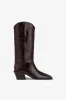 Boots in rouge noir croco-embossed leather sold by Paris Texas