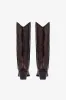 Boots in rouge noir croco-embossed leather sold by Paris Texas