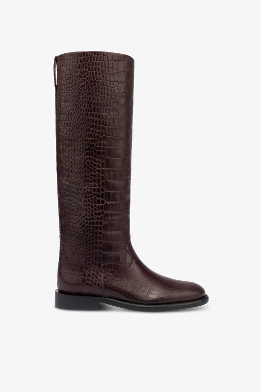 Boots in rouge noir croco-embossed leather sold by Paris Texas
