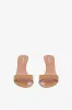 Mules in caramel patent leather sold by Paris Texas