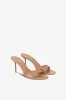 Mules in caramel patent leather sold by Paris Texas
