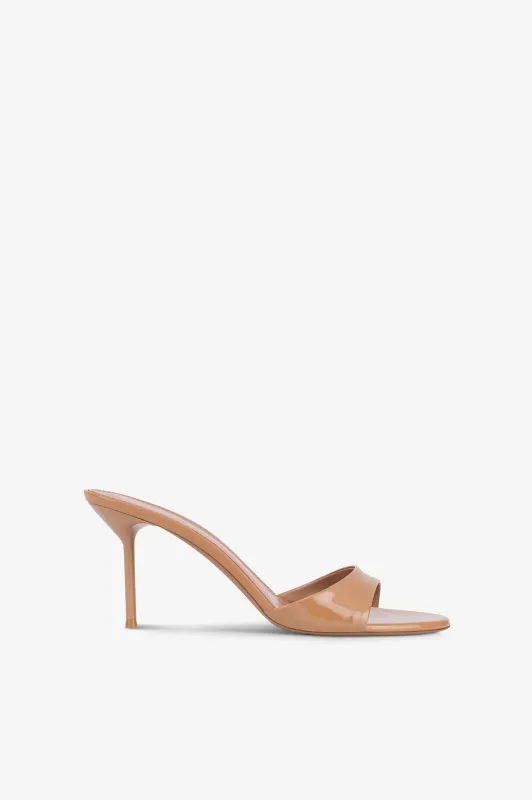 Mules in caramel patent leather sold by Paris Texas