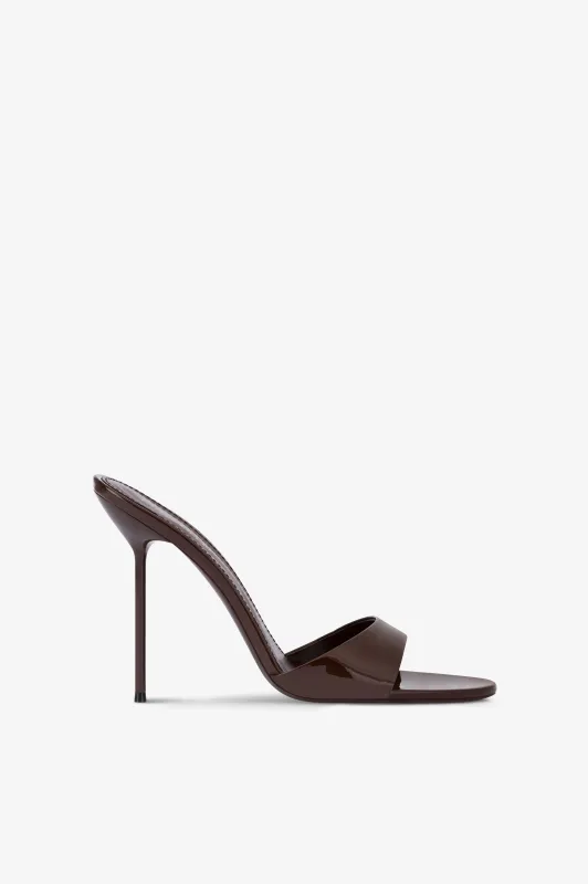 Mules in ebony patent leather sold by Paris Texas