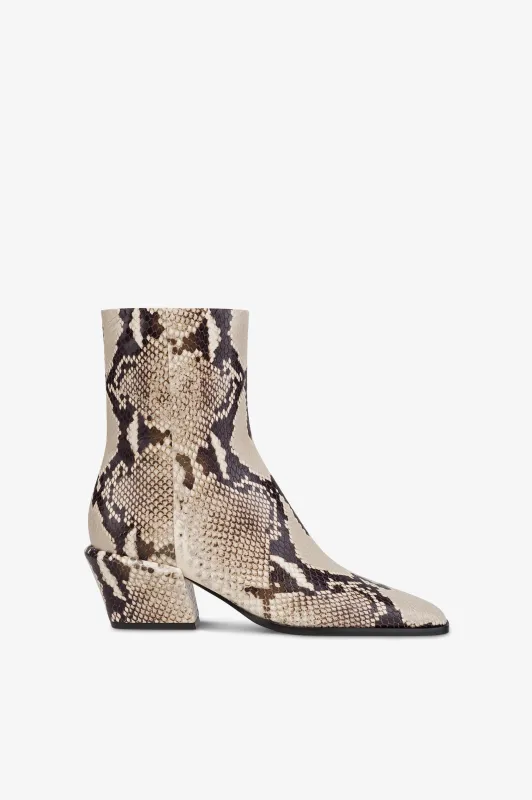 Ankle boots in natural printed python leather. sold by Paris Texas