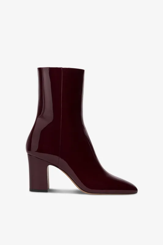 Ankle boots in rouge noir patent leather. sold by Paris Texas