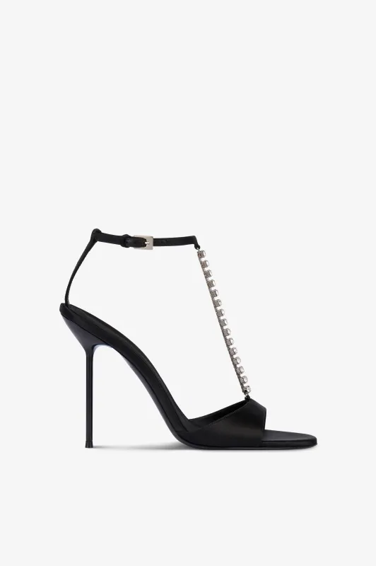 T-strap sandals in black satin with stud detailing. sold by Paris Texas