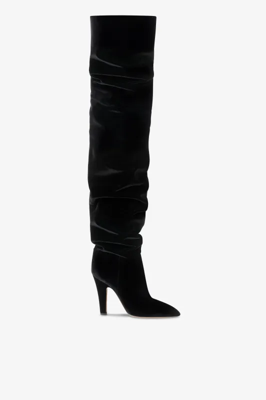 Over-the-knee boots in black velvet. sold by Paris Texas