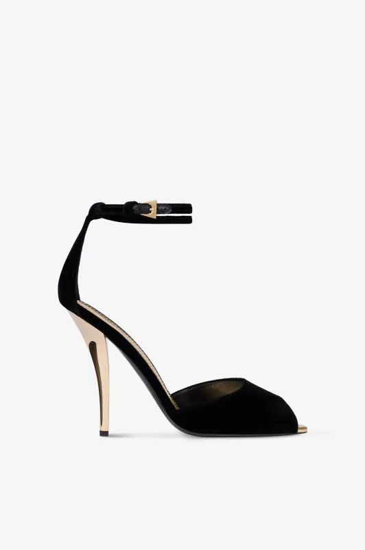 Sandals in black velvet with gold detailing. sold by Paris Texas