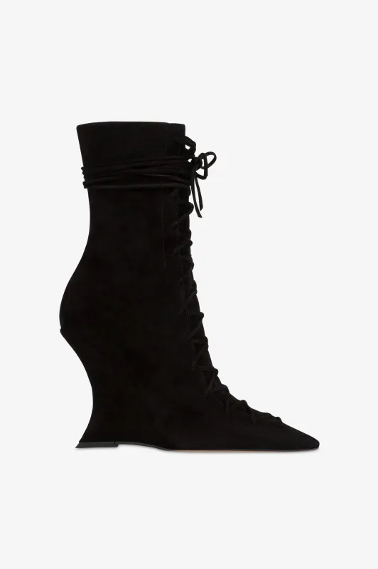 Ankle boots in black calf suede leather. sold by Paris Texas