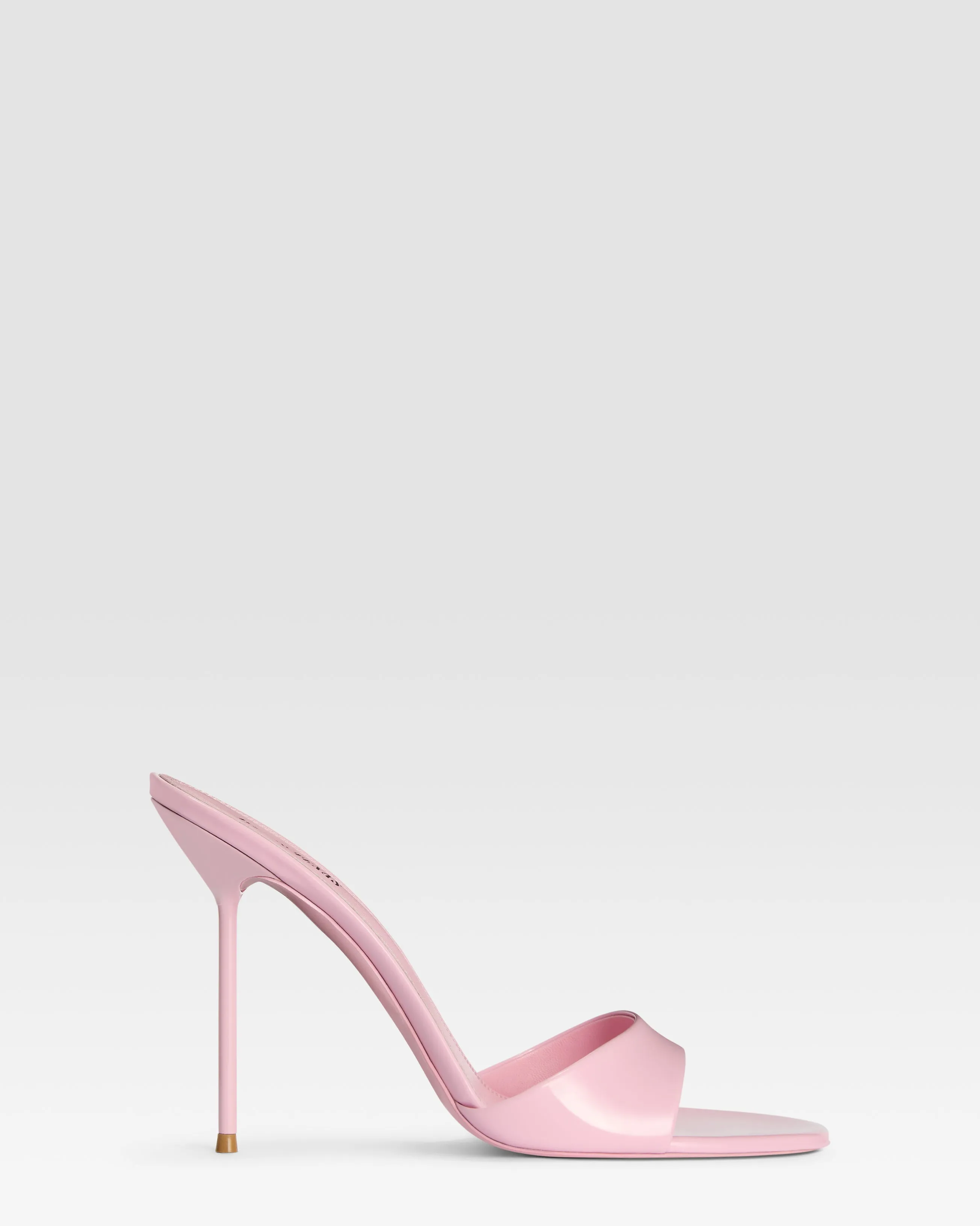 Mules in petal pink patent leather sold by Paris Texas