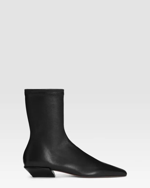 Ankle boots in black stretch leather sold by Paris Texas