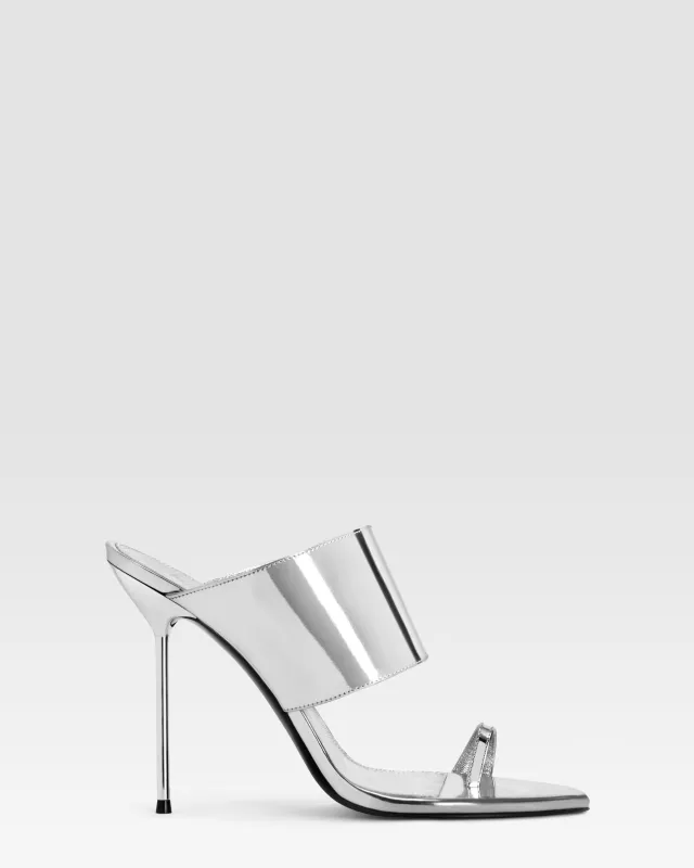 Thong-ring mules in silver, mirror-effect leather sold by Paris Texas