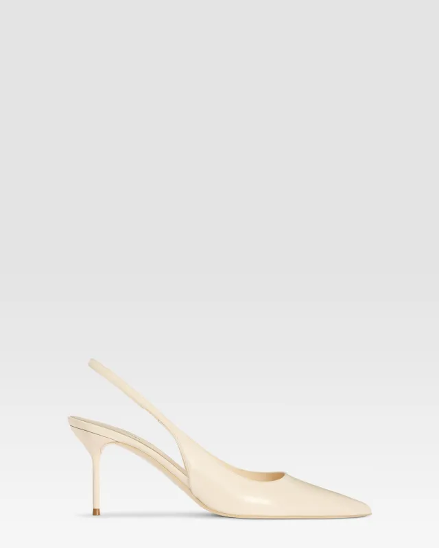 Slingbacks in ivory patent leather sold by Paris Texas