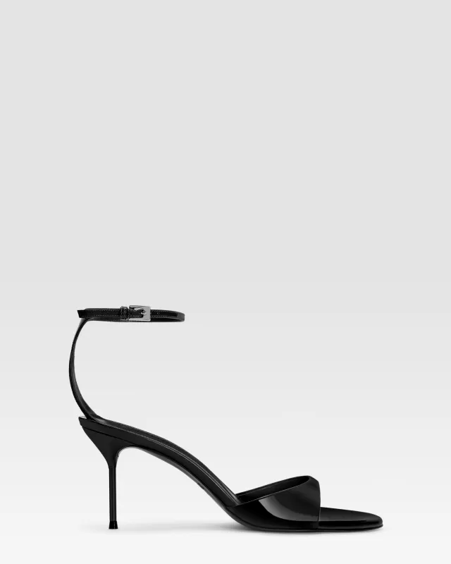 Ankle-strap sandals in black patent leather sold by Paris Texas