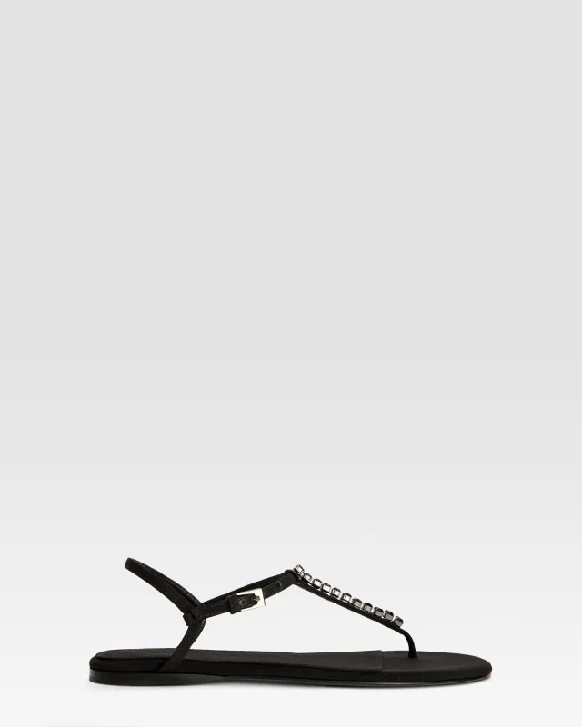 Flat sandals in black crepe satin with stud detailing sold by Paris Texas