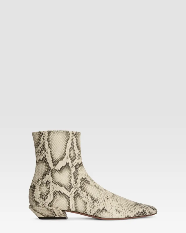 Ankle boots in sand printed python leather sold by Paris Texas