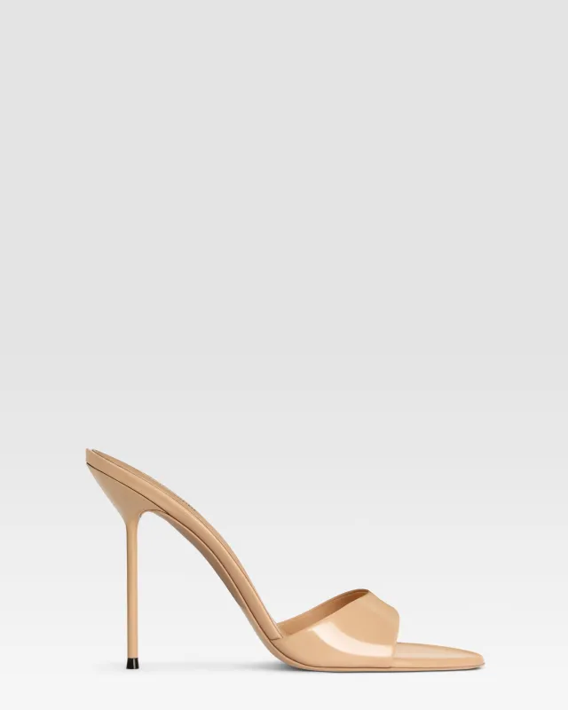 Mules in honey patent leather sold by Paris Texas