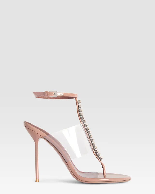 T-strap sandals in Texas rose patent leather with stud detailing sold by Paris Texas