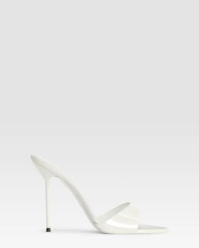 Mules in optic white patent leather sold by Paris Texas