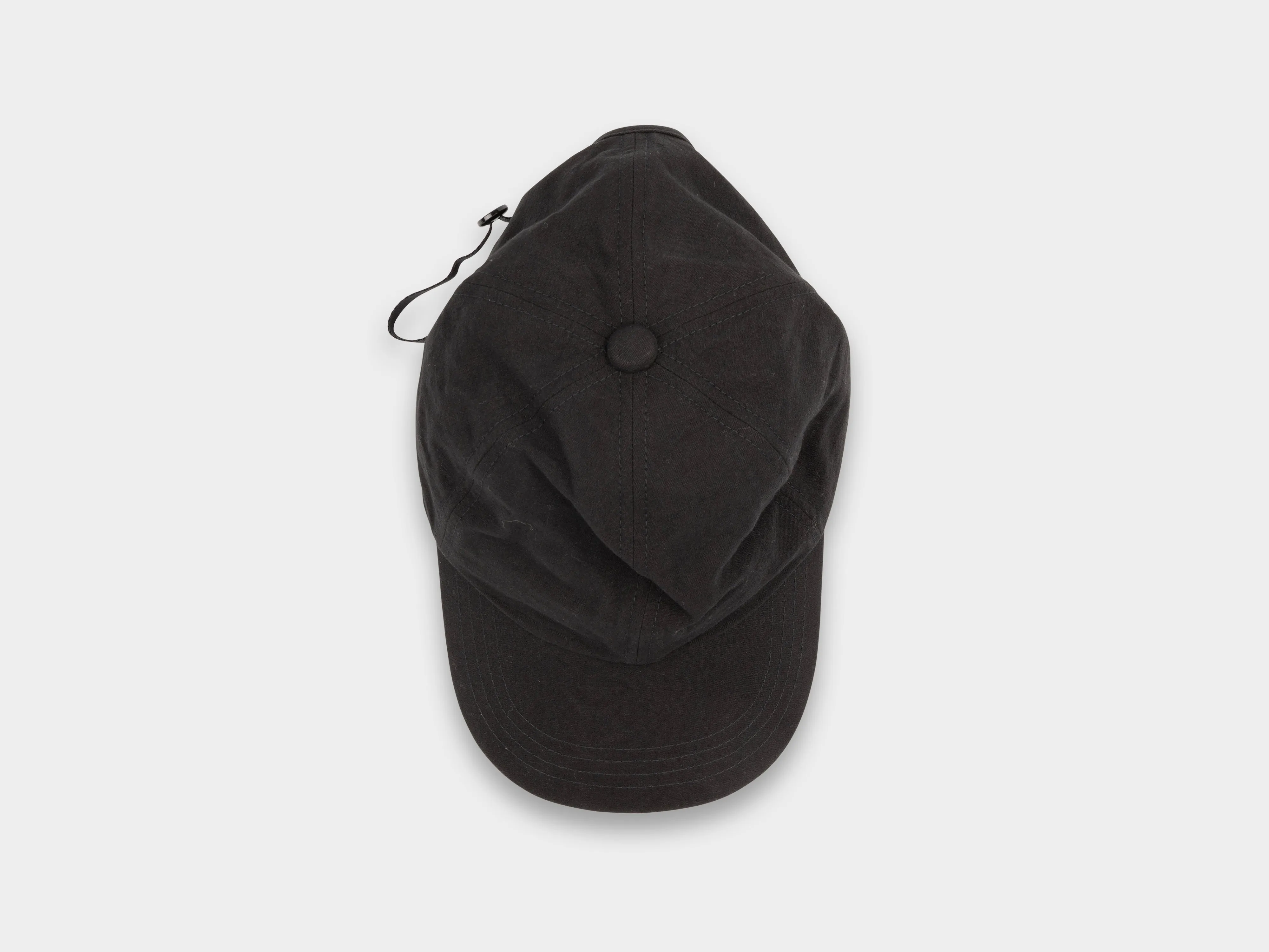 SPC1 "Shallow Cap" Roll–dyed Black Linen sold by MAN-TLE