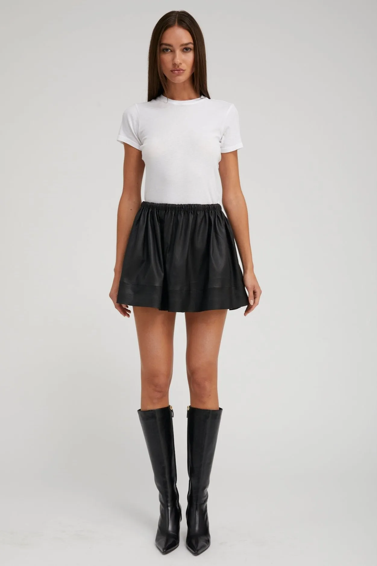Black Leather Bell Mini Skirt sold by SPRWMN
