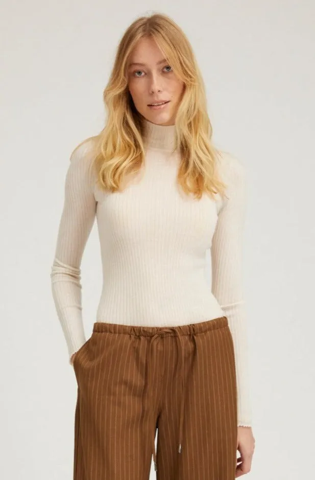 Chalk Cashmere Mock Neck sold by SPRWMN