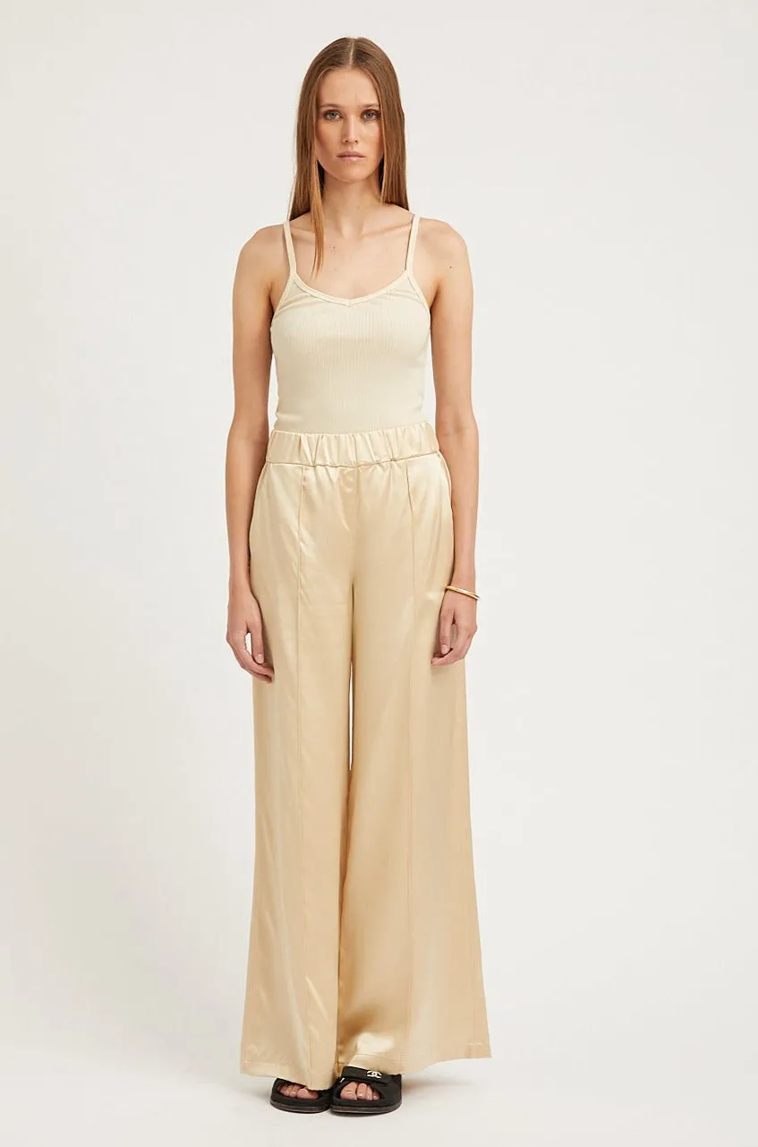 Cream Silk Wide Leg Pintuck Pants sold by SPRWMN