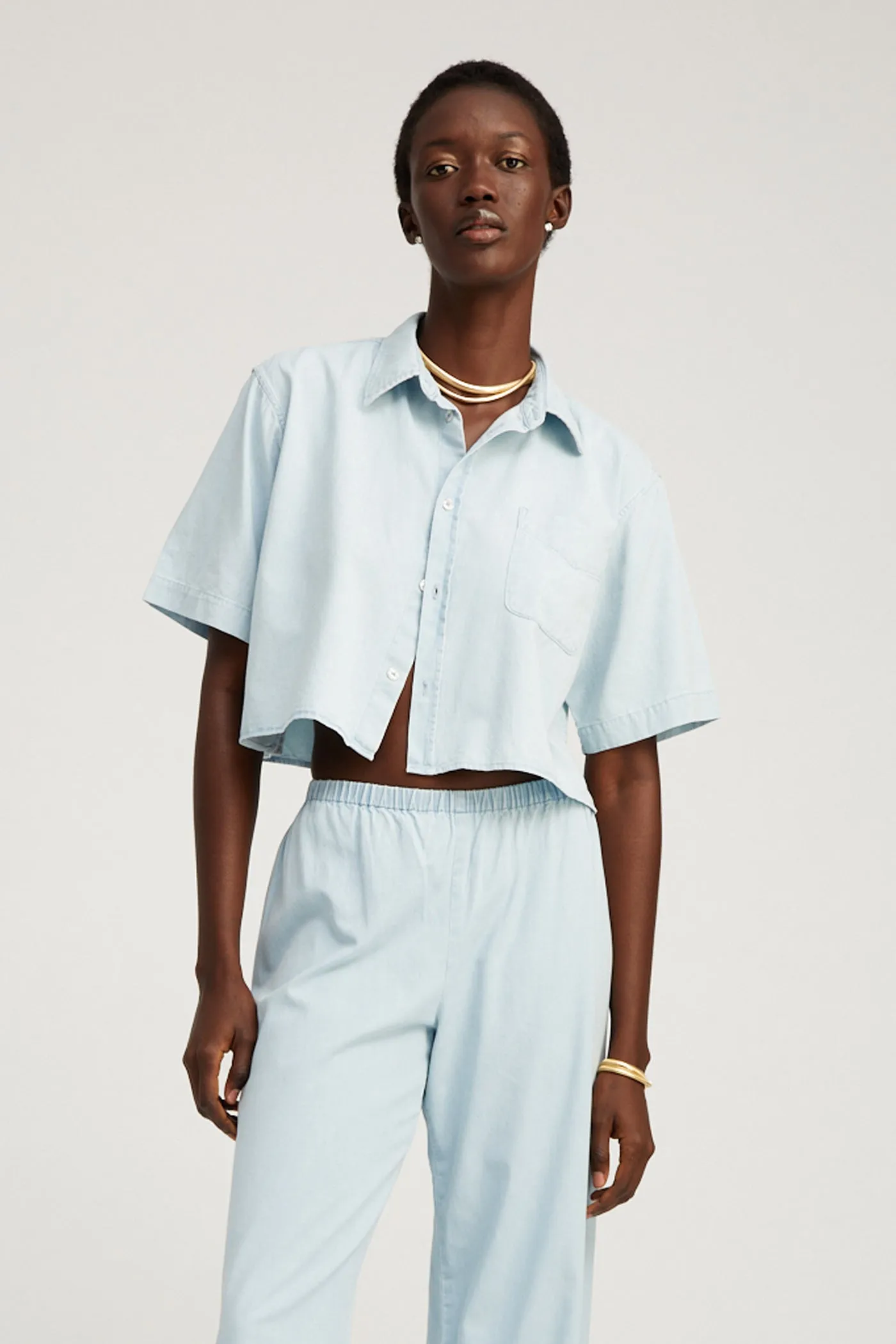 Light Blue Chambray Short Sleeve Cropped Button Down sold by SPRWMN