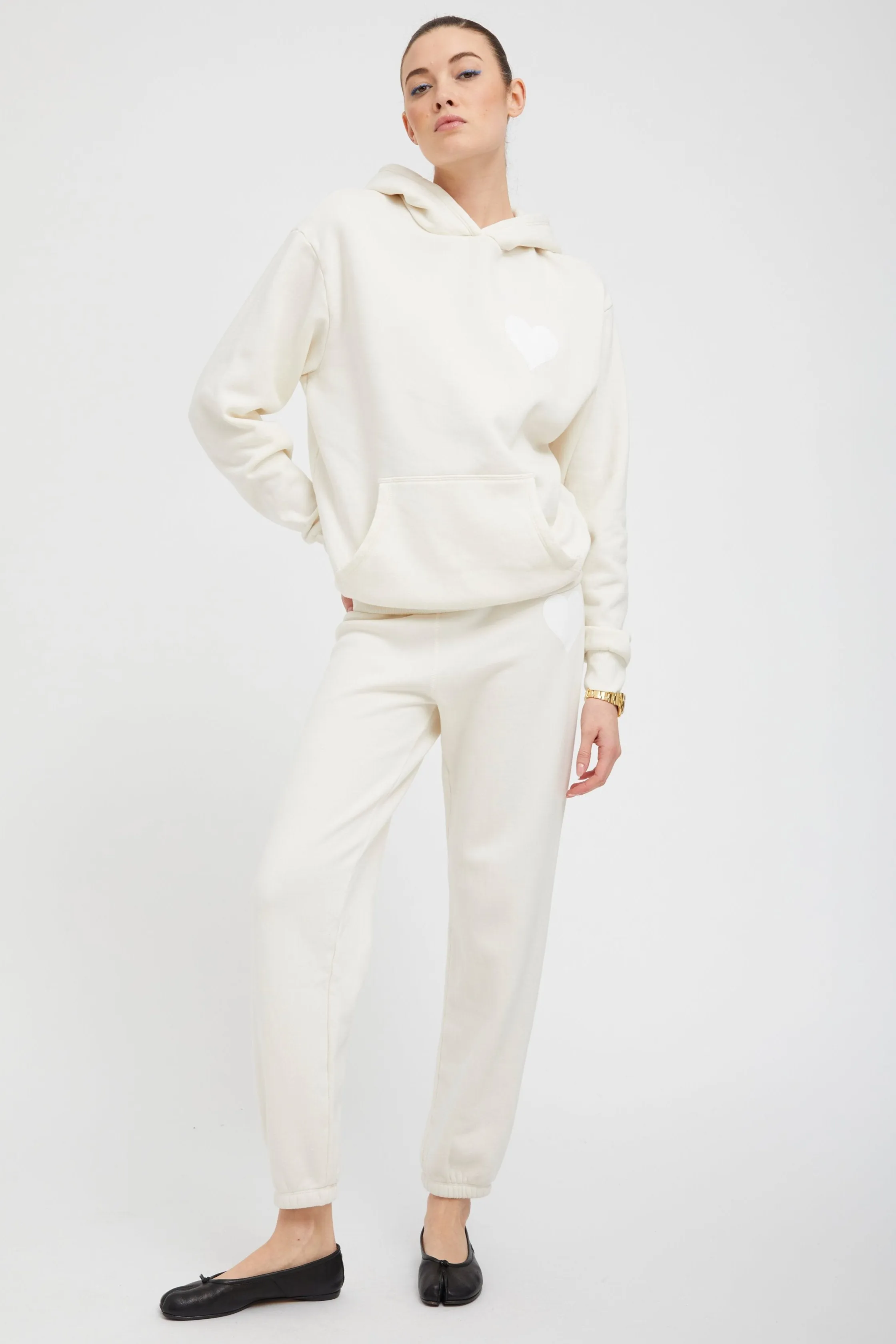 Creme with White Heart Sweatpants sold by SPRWMN