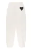 Vintage White Heart Sweatpants sold by SPRWMN